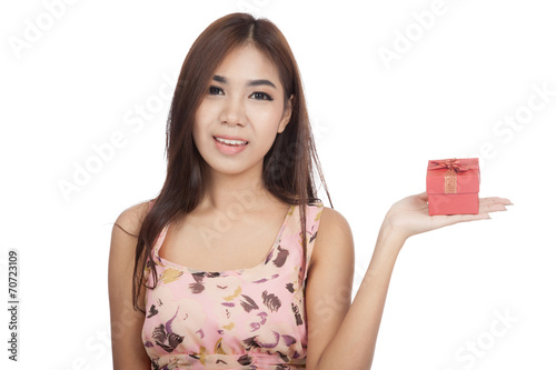 Beautiful Asian woman show red gift box on her palm hand