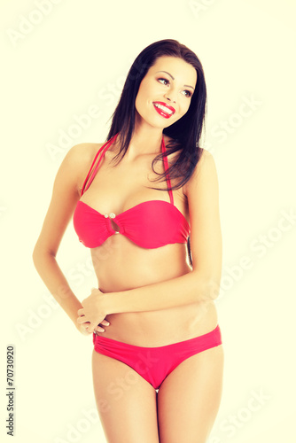 Beautiful young woman in a red bikini