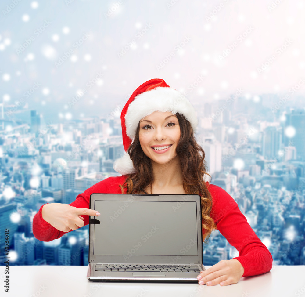 smiling woman in santa helper hat with laptop smiling woman in santa helper hat with laptop
