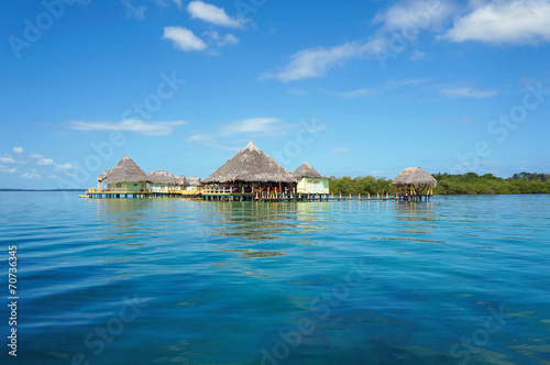 Tropical resort overwater with thatched roofs © dam