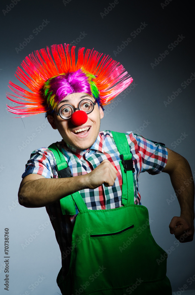 Funny clown against the grey background Funny clown against the grey background