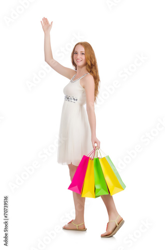 Woman after shopping spree on white