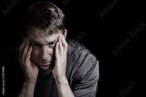 Mature man with headache from stress photo
