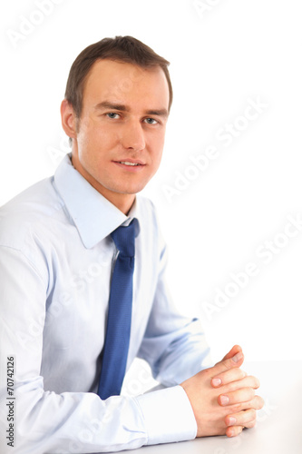 Portrait of a happy young businessman, isolated on white