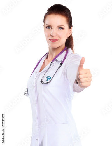 Young woman doctor showing ok   standing in hospital