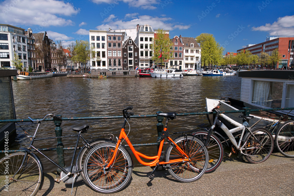 Amsterdam city with bikes on the bridge in  Holland
