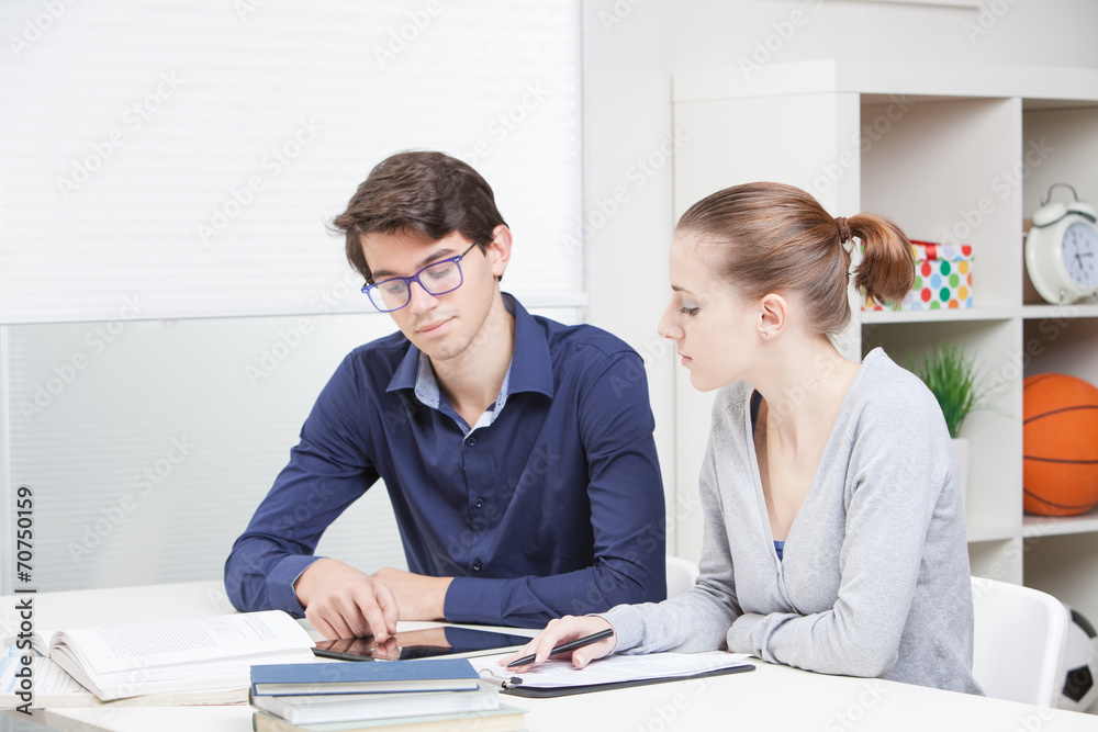 Students looking at tablet pc Students looking at tablet pc