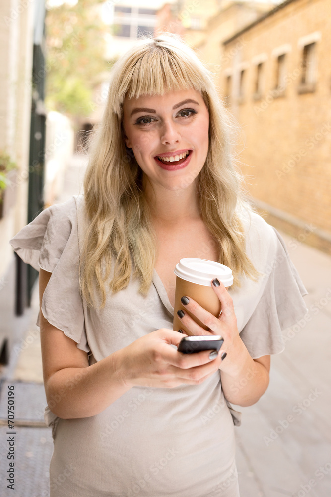 young woman with phone and coffee young woman with phone and coffee