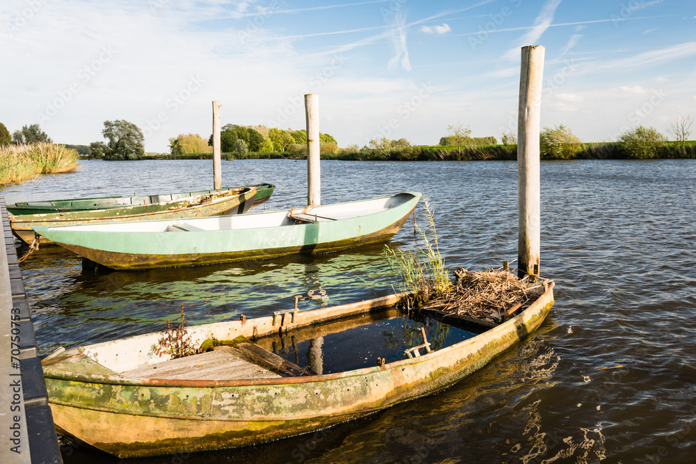 Grass growing at a neglected rowboat