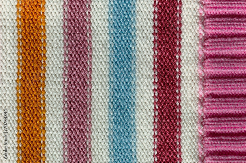 Knit woolen texture. Fabric striped background