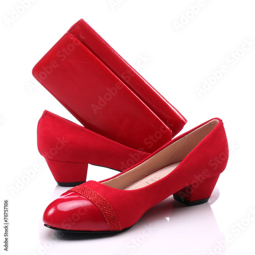 Women's shoes and a red wal...