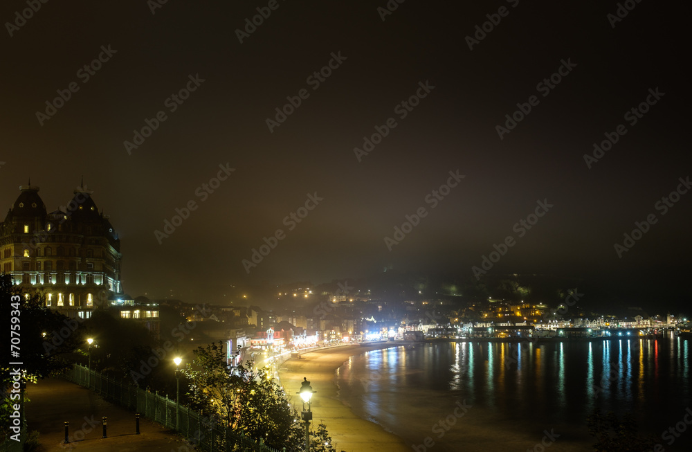 View of Grand Hotel, Scarborough, harbour at night, in the fog.