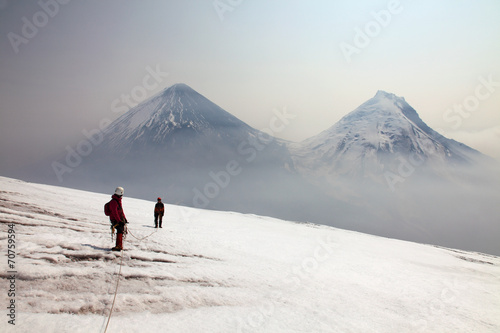 Alpinists on the top of Ploskaya volcano.