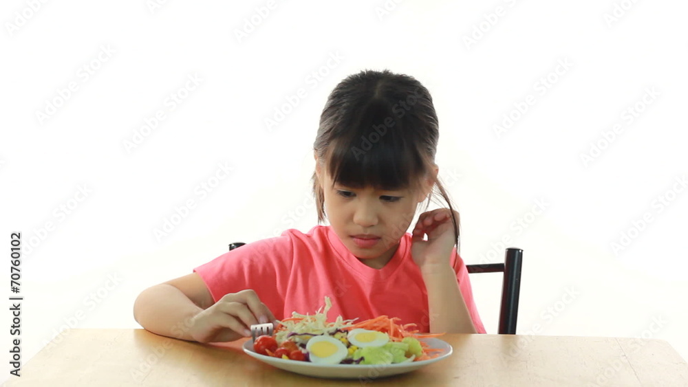 young girl doesn't like eating vegetables young girl doesn't like eating vegetables