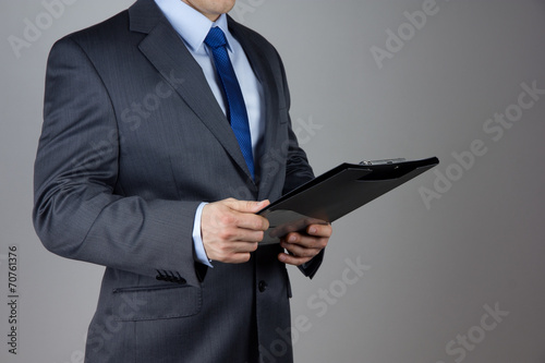 business man holding folder with documents