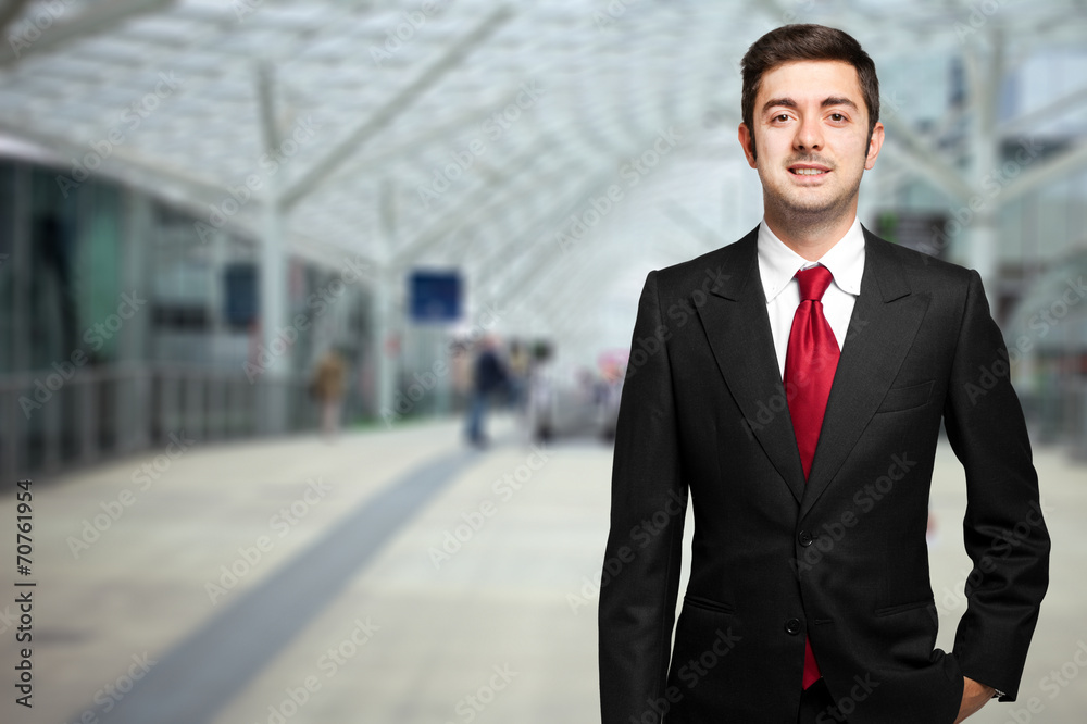 Smiling businessman standing outdoor