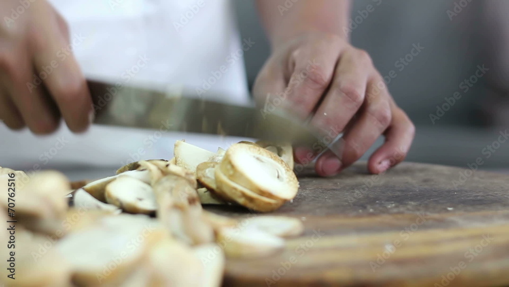 Close up Chef hand slicing mushrooms Close up Chef hand slicing mushrooms