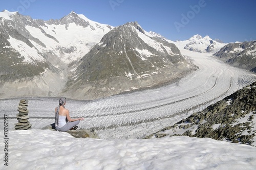Girl meditating in mountains