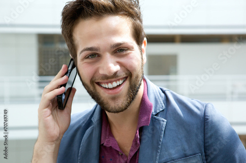 Face of a man talking on mobile phone