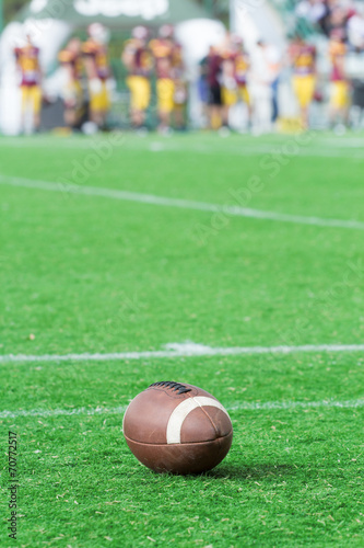 American football/rugby ball on the court.