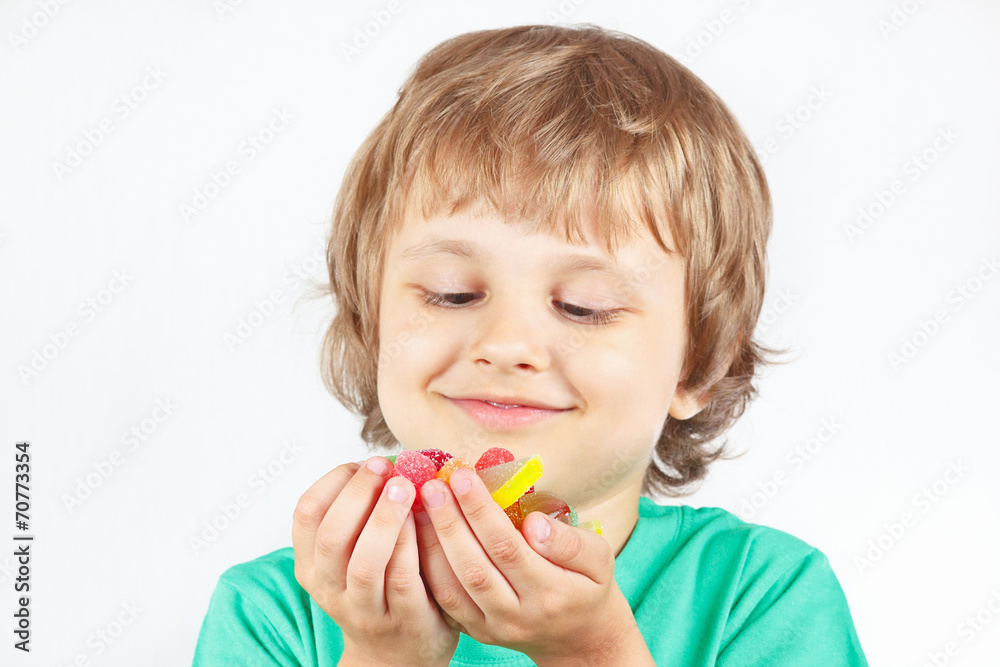 Smiling child with sweets and jelly candies Smiling child with sweets and jelly candies