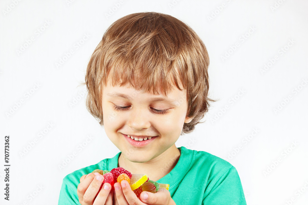 Boy with colored sweets and jelly candies Boy with colored sweets and jelly candies