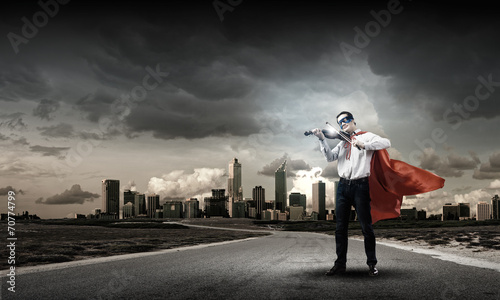 Superman with violin © Sergey Nivens