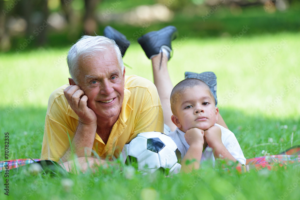 happy grandfather and child in park happy grandfather and child in park