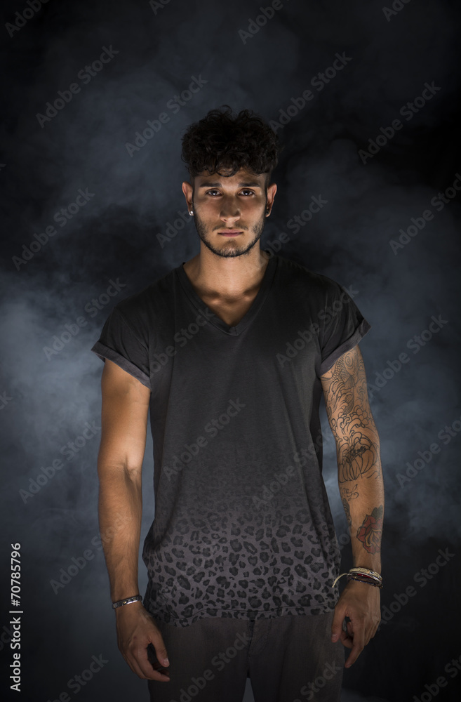 Portrait of handsome young man in dark t-shirt