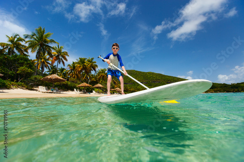 Little boy on stand up paddle board © BlueOrange Studio