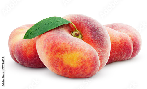 Three chinese flat donut peaches with leaf isolated on white