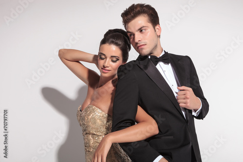 Woman wearing elegant dress holding her lover arm
