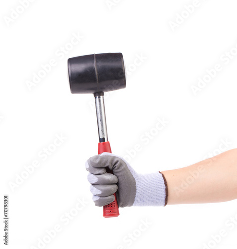Hand holding black hammer.
