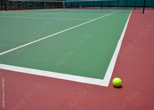 tennis ball on green court © sutichak