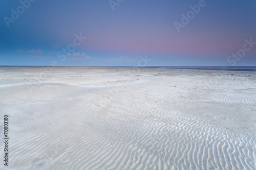 sand beach on North sea at sunrise