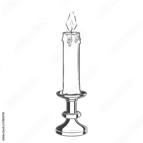 Burning old candle and vintage candlestick