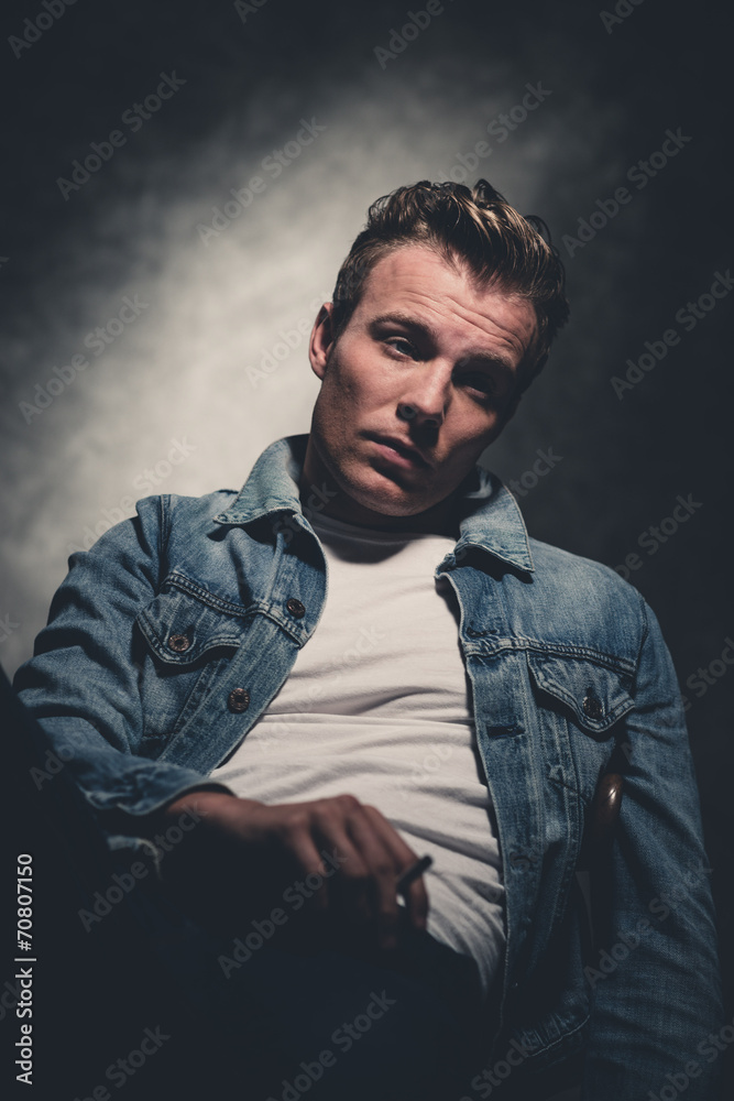 Cigarette smoking retro fifties cool rebellion fashion man weari Cigarette smoking retro fifties cool rebellion fashion man weari