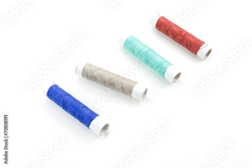 Spool of thread on white background