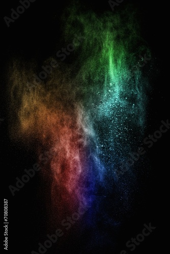 Fototapeta Naklejka Na Ścianę i Meble -  Colourful powder exploding isolated on black