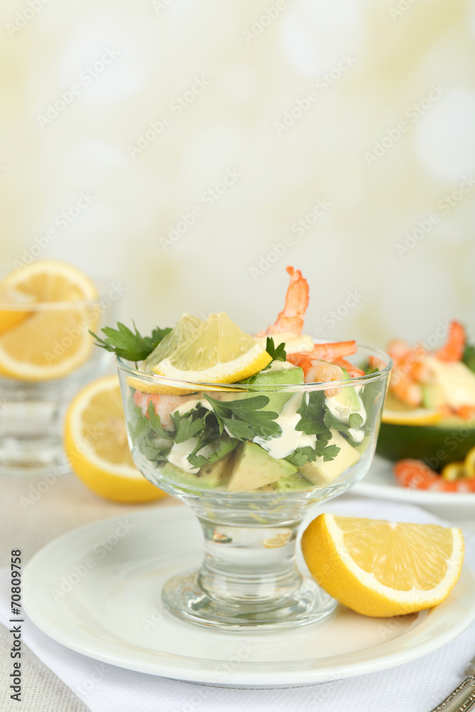 Tasty salads with shrimps and avocado in glass bowl and Tasty salads with shrimps and avocado in glass bowl and