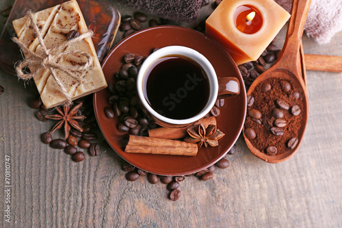 Cup with coffee drink, soap with coffee beans and spices