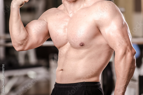 Muscular man showing his biceps