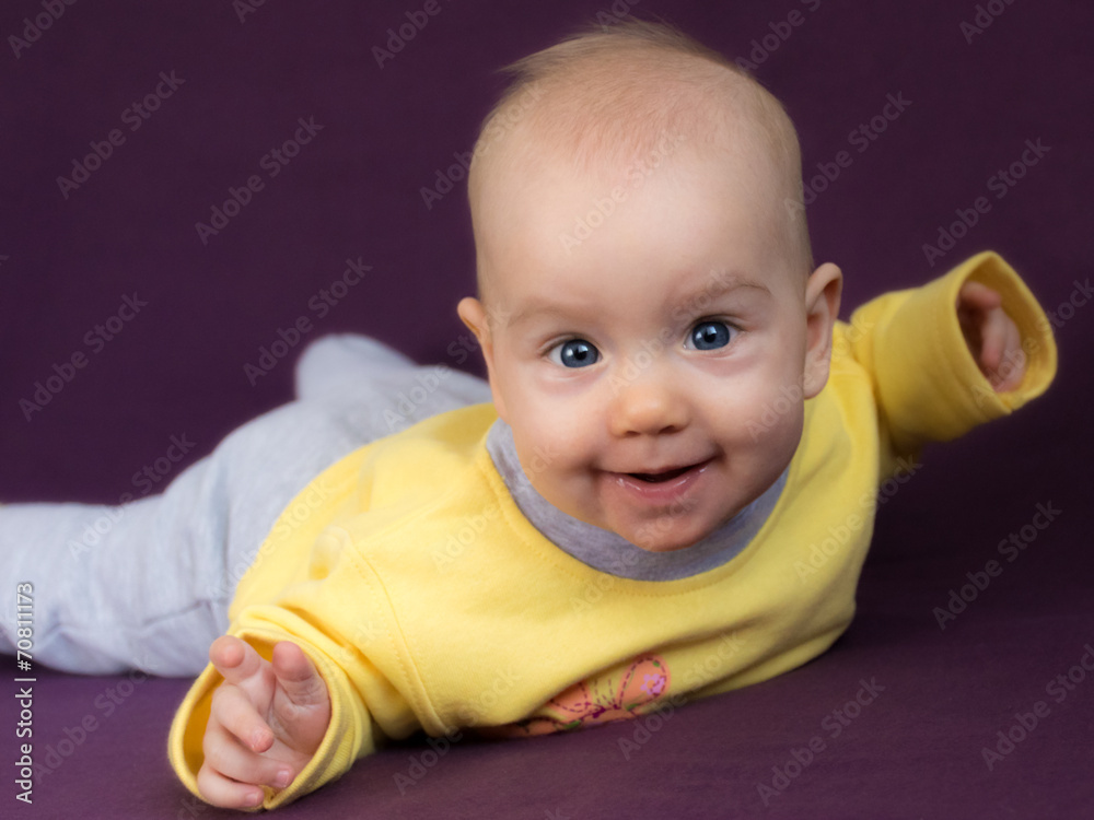 Happy child in seal or plane pose. Happy child in seal or plane pose.