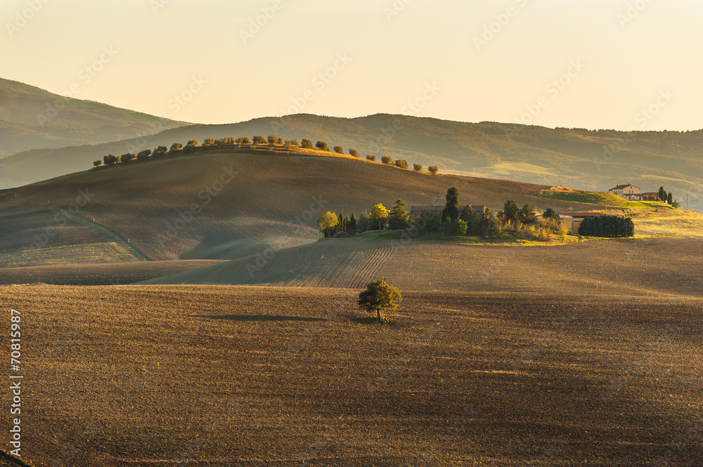 The setting sun over the valley of the Orcia in Tuscany, Italy