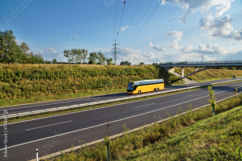 Corridor highway with yellow bus