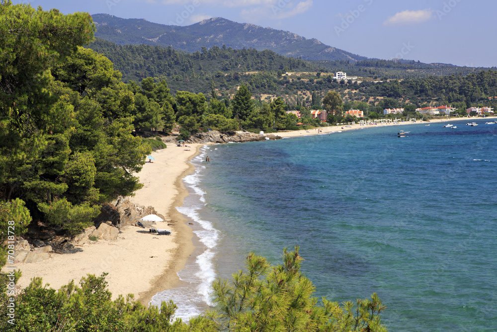 Wild sandy beach in the bay of the Aegean Sea.
