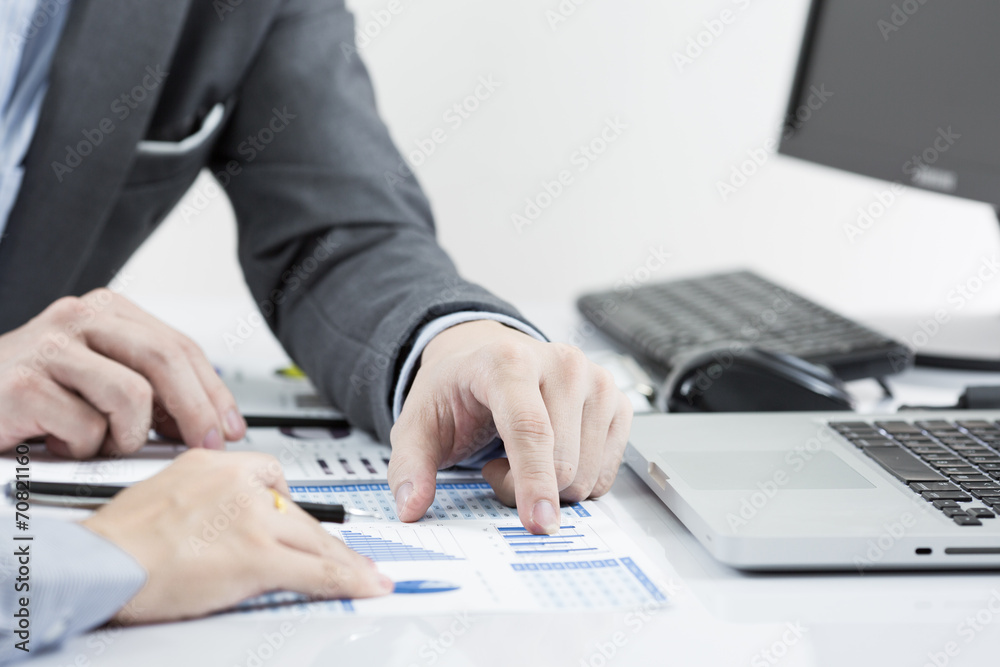 Business people discussing during a meeting on table Business people discussing during a meeting on table