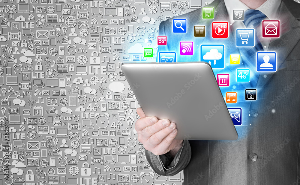 Business man use tablet pc with colorful application icons Business man use tablet pc with colorful application icons