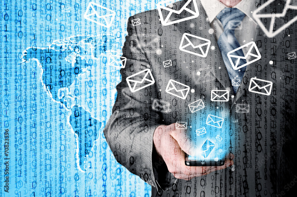 Business man holding smart phone and sending emails Business man holding smart phone and sending emails