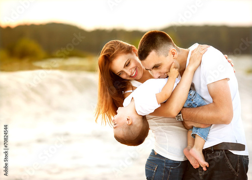 parents with baby in park